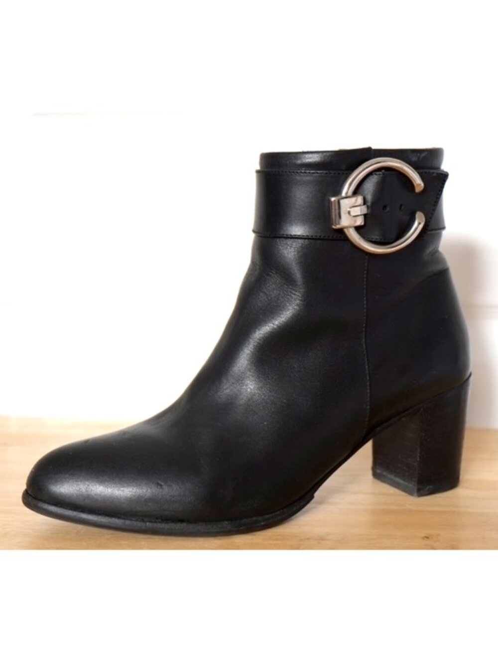Poppy Barley black leather ankle boots with silver buckle